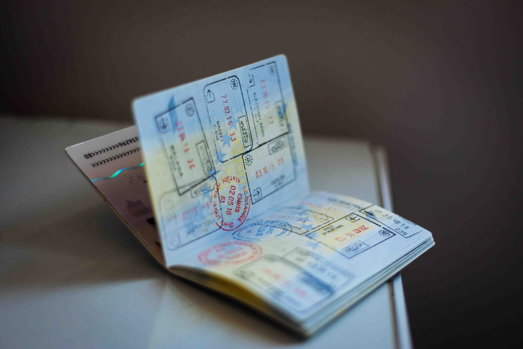 An open passport with stamps, ready for a Malaysian student visa
