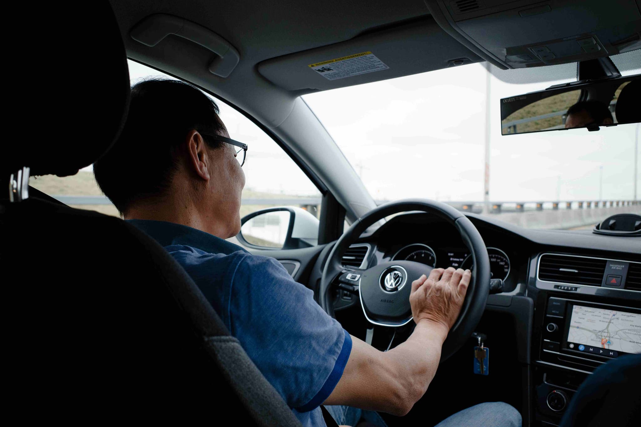 A driver taking a passenger on a car ride within Malaysia