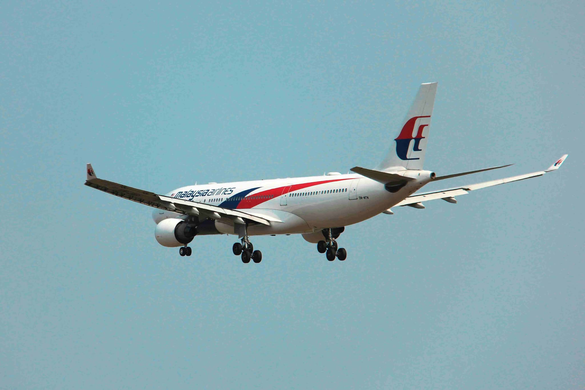 A Malaysia Airlines plane coming in to land, where a student's airport pickup begins