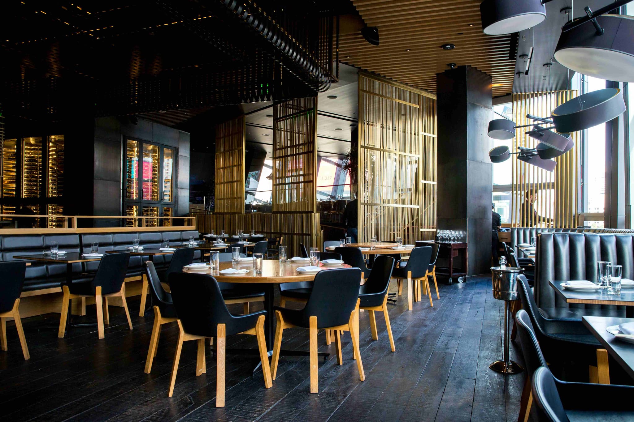 An elegant restaurant dining room set for guests